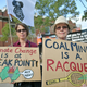 Demonstrators hold up placards outside the Australian Open venue during a climate protest rally in Melbourne on January 24, 2020.